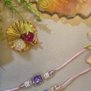 Pair of pink and lavender rakhis with kundan pendants